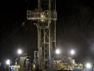  shale gas well operates at night in Moshannon State Forest in Clearfield County, Pa. Twenty states including Pennsylvania have shale gas wells, rigs that tap rock layers harboring gas in shale formations.
